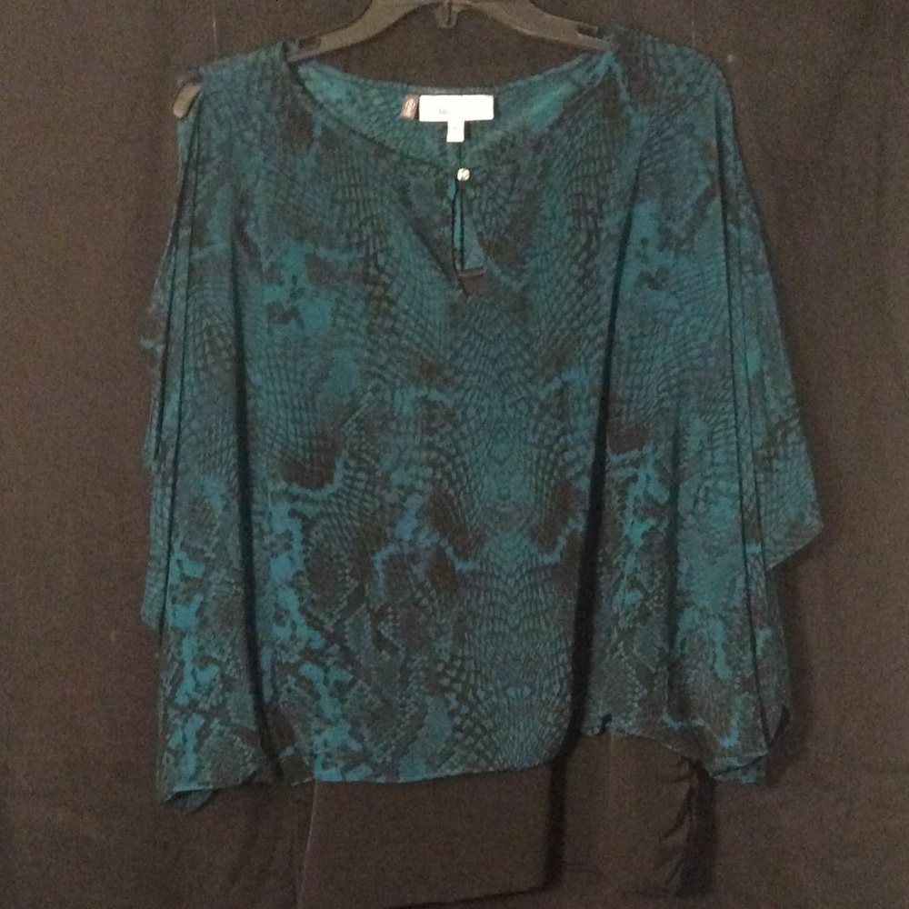 Jennifer Lopez cold shoulder animal print top